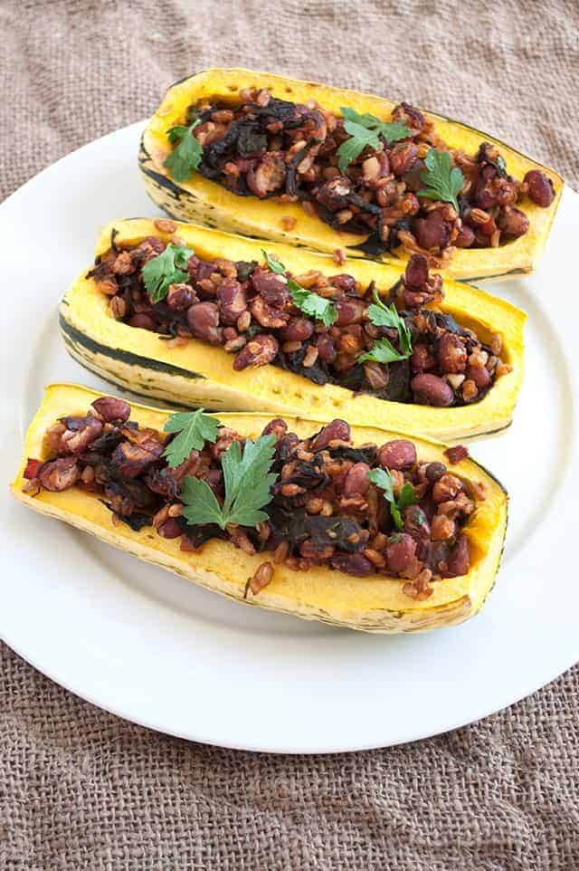 A stuffed delicata squash with Swiss chard, whole grains and red beans perfect for any fall meal.