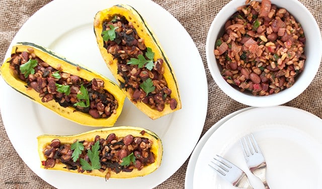 A stuffed delicata squash with Swiss chard, whole grains and red beans perfect for any fall meal.