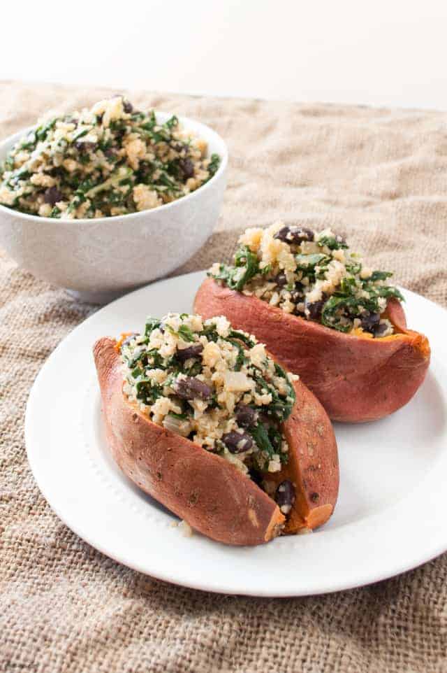 Up your stuffed sweet potato game with cauliflower rice, kale and black beans.