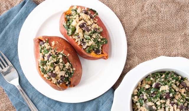 Up your stuffed sweet potato game with cauliflower rice, kale and black beans.