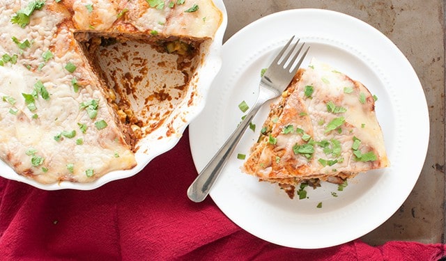 A vegetarian tortilla pie with beans, cheese, and the end of summer vegetables great to make ahead for a busy week. | Vegetarian Tortilla Pie from small-eats.com