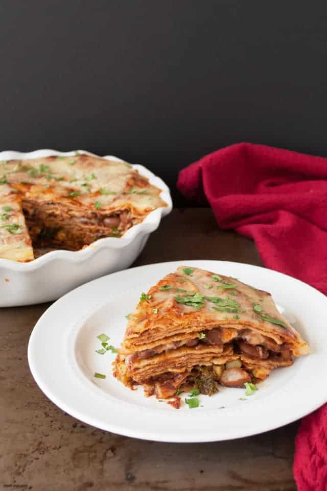 A vegetarian tortilla pie with beans, cheese, and the end of summer vegetables great to make ahead for a busy week. | Vegetarian Tortilla Pie from small-eats.com