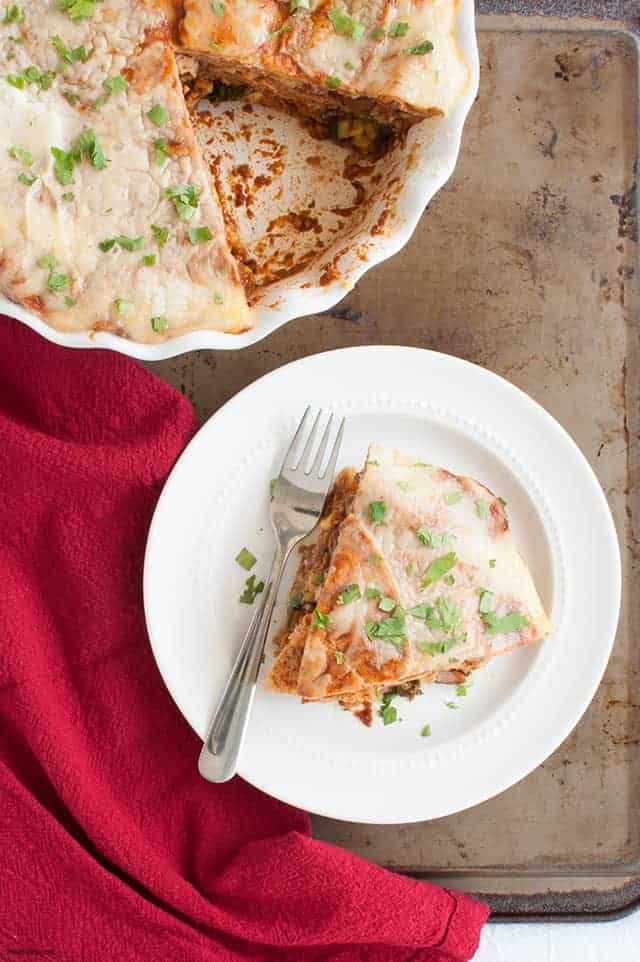 A vegetarian tortilla pie with beans, cheese, and the end of summer vegetables great to make ahead for a busy week. | Vegetarian Tortilla Pie from small-eats.com