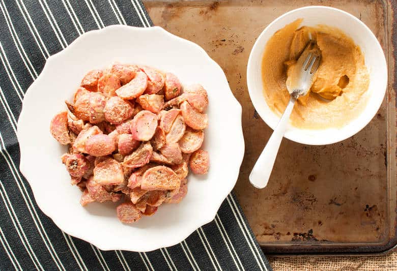 A quick and simple roast radish dish mixed with tahini. | Roasted Radishes with Tahini from small-eats.com