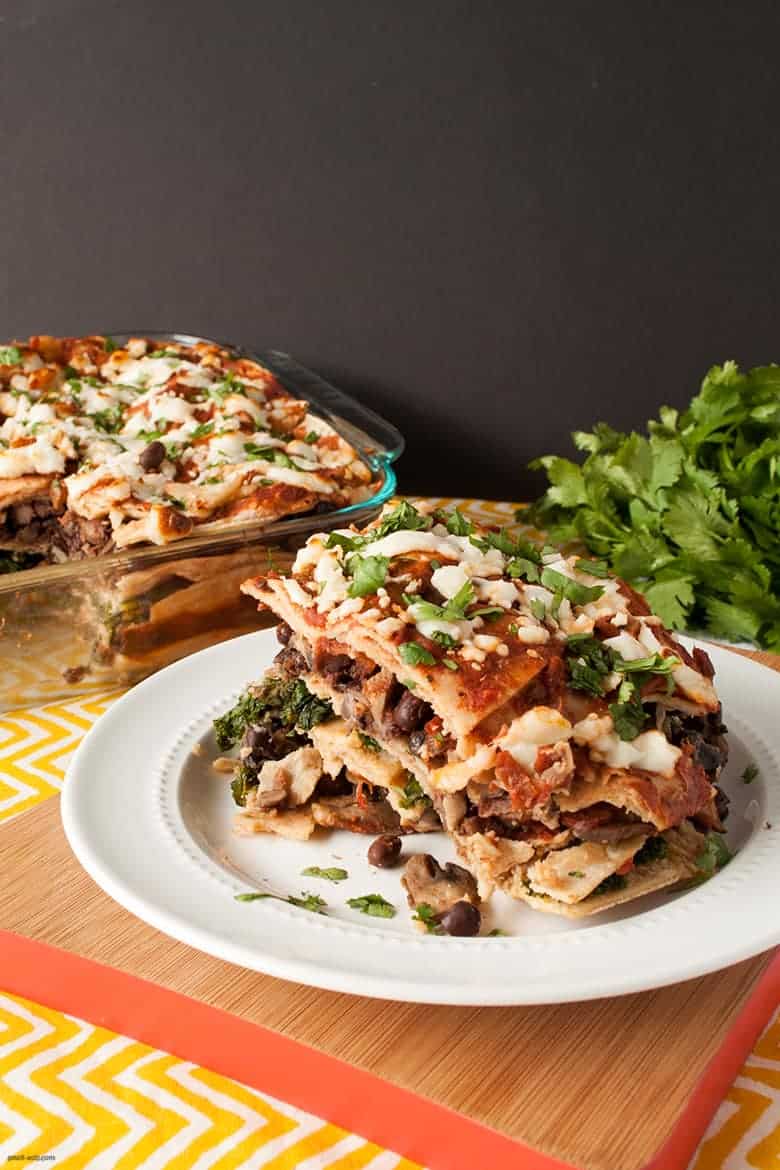 A filling, Mexican inspired casserole filled with black beans, kale, and mushrooms. | Greens and Beans Tortilla Casserole from small-eats.com 