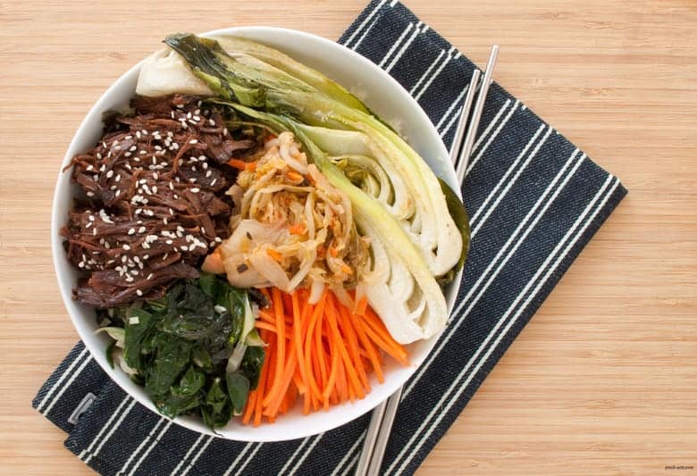 Enjoy a paleo twist to a Korean beef bowl, loaded with raw, cooked, and fermented veggies.| Korean Beef Bowls from small-eats.com