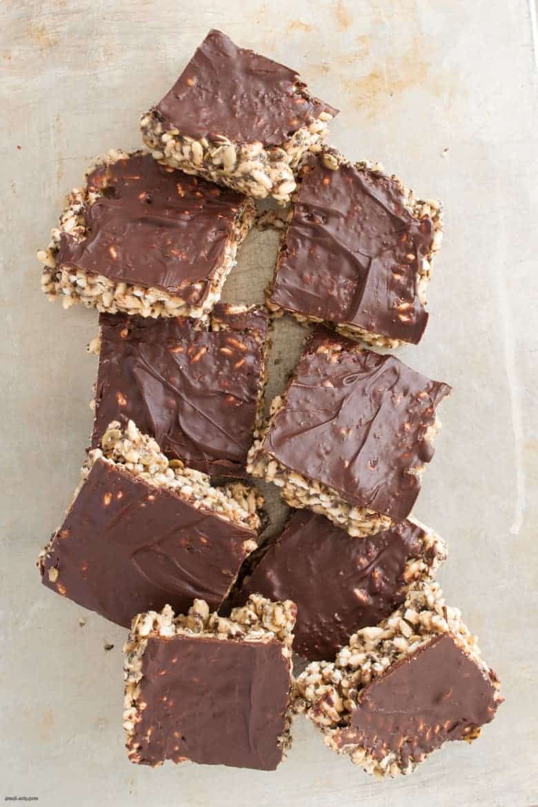 A nut free rice crispy treat packed with healthy seeds and topped with a luxurious layer of chocolate. | Tahini Rice Crispy Treats from small-eats.com 