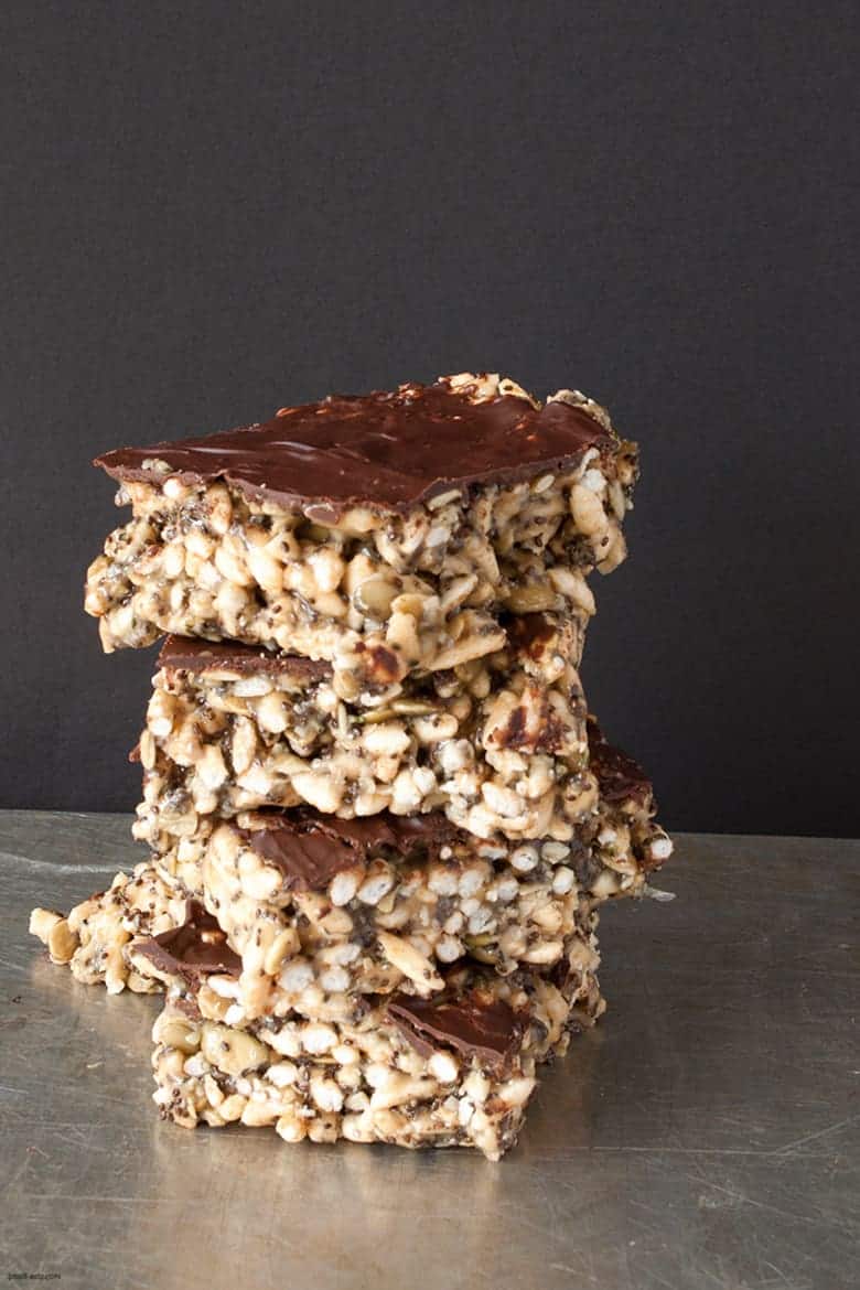 A nut free rice crispy treat packed with healthy seeds and topped with a luxurious layer of chocolate. | Tahini Rice Crispy Treats from small-eats.com 