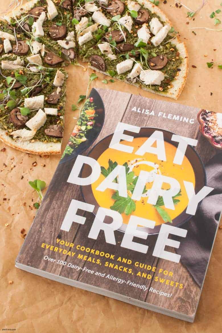 A simple and delicious dairy free and gluten free pizza perfect for a quick weeknight dinner or entertaining friends from Alisa Flemings' new book, Eat Dairy Free. | Mushroom Pesto Pizza from small-eats.com 