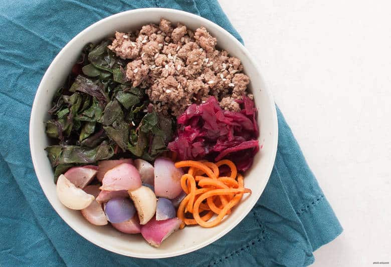 Enjoy a gluten and grain free sweet potato bowl with ground beef, roasted radishes, Swiss chard and sauerkraut. | Beef Sweet Potato Noodle Bowls from small-eats.com