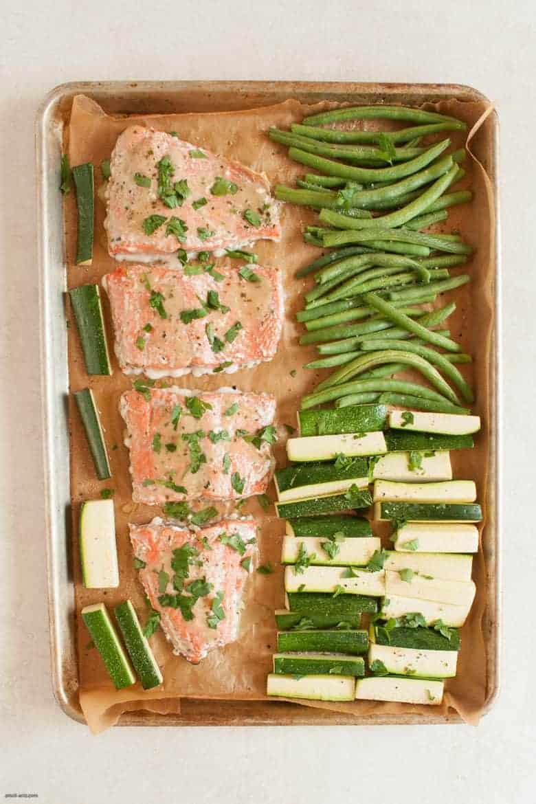 A simple and tasty salmon dinner that's packed with veggies and easy to make any night of the week. | Salmon Sheet Pan Dinner from small-eats.com
