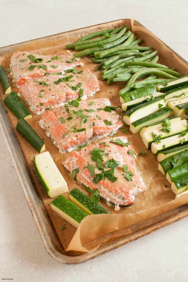 A simple and tasty salmon dinner that's packed with veggies and easy to make any night of the week. | Salmon Sheet Pan Dinner from small-eats.com
