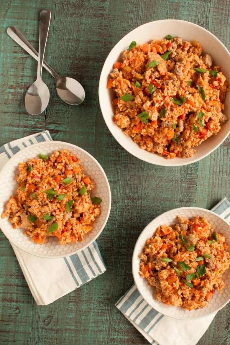 Enjoy a quick and flavorful jambalaya meal that can be made in one pot from Linda Kurnaidi's latest cookbook, 5-Ingredient One Pot Cookbook: Easy Dinners from Your Skillet, Dutch Oven, Sheet Pan & More. | Italian Sausage Jambalaya from small-eats.com