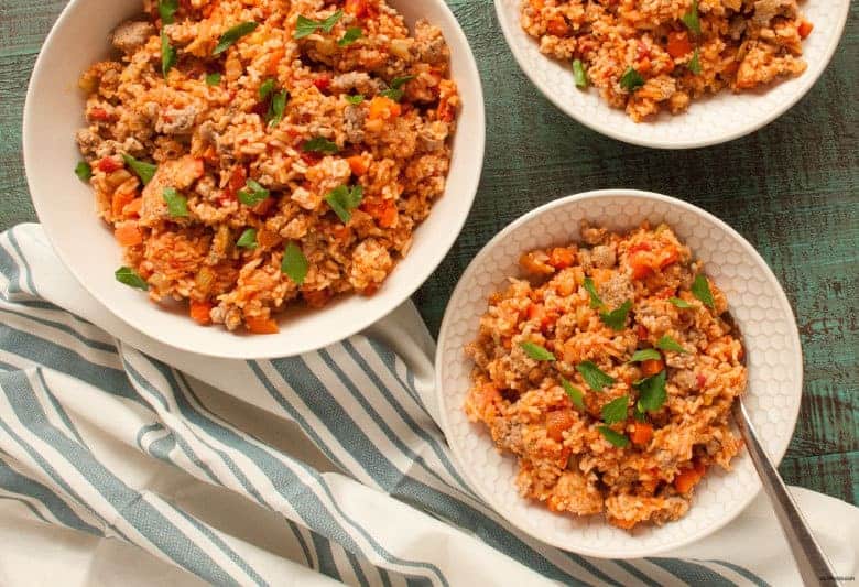 Enjoy a quick and flavorful jambalaya meal that can be made in one pot from Linda Kurnaidi's latest cookbook, 5-Ingredient One Pot Cookbook: Easy Dinners from Your Skillet, Dutch Oven, Sheet Pan & More. | Italian Sausage Jambalaya from small-eats.com