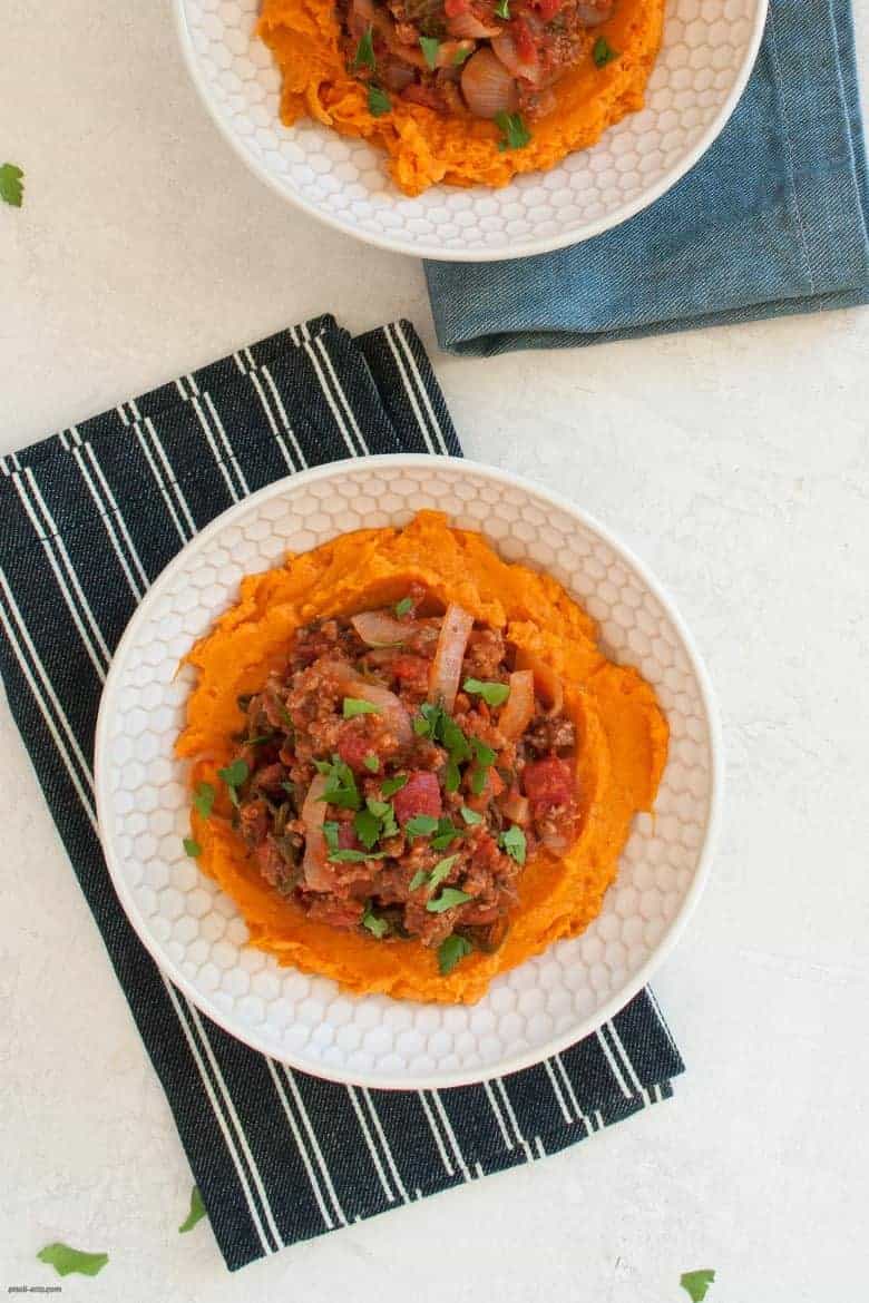 A comforting and easy to make weeknight dinner packed with ground beef, vegetables and mashed sweet potatoes. | Ground Beef, Arugula and Sweet Potato Mash Bowl (gluten free, dairy free) from small-eats.com