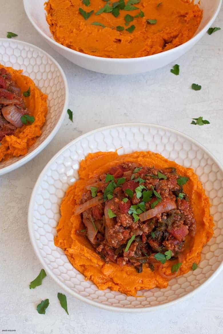 A comforting and easy to make weeknight dinner packed with ground beef, vegetables and mashed sweet potatoes. | Ground Beef, Arugula and Sweet Potato Mash Bowl (gluten free, dairy free) from small-eats.com