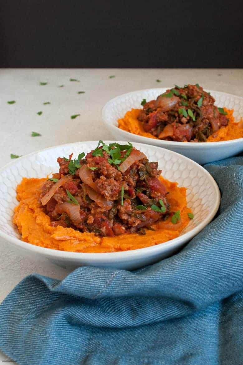 A comforting and easy to make weeknight dinner packed with ground beef, vegetables and mashed sweet potatoes. | Ground Beef, Arugula and Sweet Potato Mash Bowl (gluten free, dairy free) from small-eats.com
