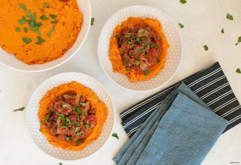 A comforting and easy to make weeknight dinner packed with ground beef, vegetables and mashed sweet potatoes. | Ground Beef, Arugula and Sweet Potato Mash Bowl (gluten free, dairy free) from small-eats.com